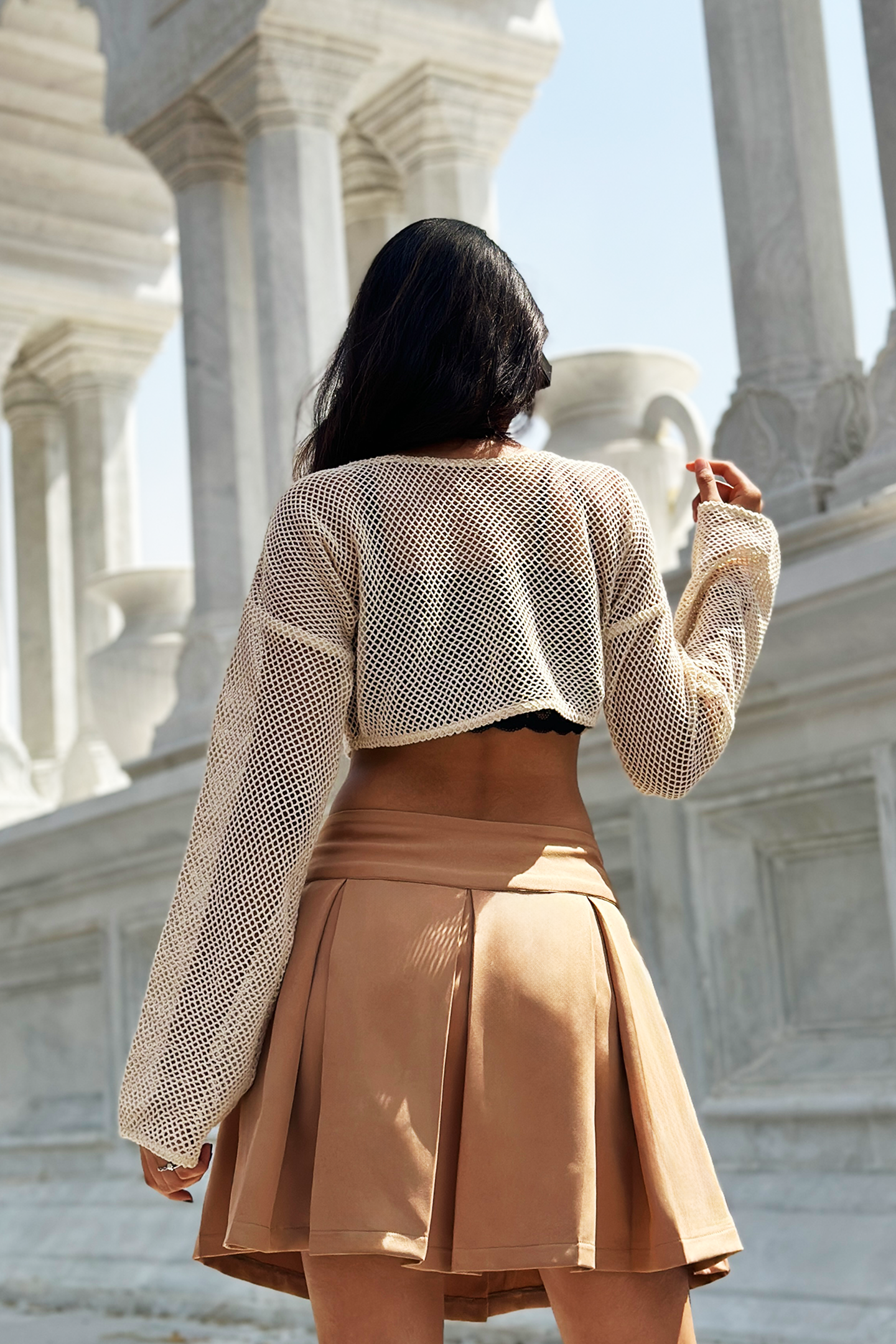 A fashionable Ronazen caramel flare A-line skirt, featuring a rich, warm caramel hue. The skirt has a soft, flowing texture and an elegant flare that enhances its A-line shape, making it perfect for a stylish and sophisticated look