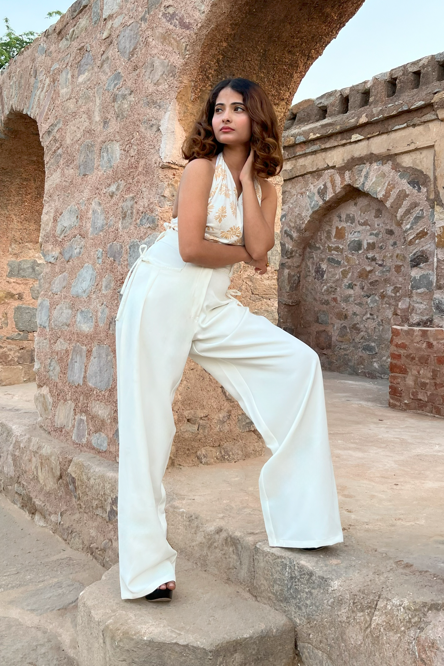 A pair of Ronazen loose fit white pocketed pants displayed against a neutral background. The pants are designed with a relaxed and comfortable fit, featuring multiple pockets. The fabric appears light and breathable, suitable for casual wear. The overall look is simplistic and versatile, ideal for a variety of outfits